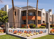 Thumbnail 2 of 36 - a building with palm trees in front of it