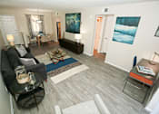 Thumbnail 5 of 25 - a living room with a couch and a table
