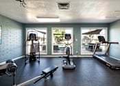 Thumbnail 21 of 25 - a gym with exercise equipment and windows at the resort at longboat key club