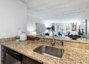 Thumbnail 8 of 35 - apartment kitchen and living room