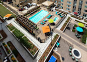 Thumbnail 17 of 35 - an overhead view of a swimming pool in the middle of an apartment building