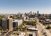 Thumbnail 17 of 18 - A cityscape with a clear blue sky above.