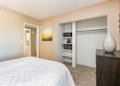 Thumbnail 11 of 33 - a bedroom with a bed and a closet