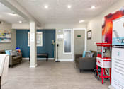 Thumbnail 32 of 33 - a lobby with couches and chairs and a candy machine