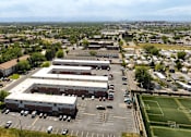 Thumbnail 35 of 35 - an aerial view of a large industrial building in a parking lot