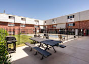 Thumbnail 25 of 35 - our apartments have a patio with a picnic table and a grill