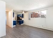 Thumbnail 16 of 35 - kitchen with navy cabinets and a black refrigerator