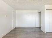 Thumbnail 12 of 35 - Vacant model living room area and wood floors
