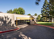 Thumbnail 16 of 16 - the gate to the parking lot of a school is closed