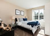 Thumbnail 6 of 16 - a bedroom with a bed and a window