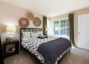 Thumbnail 10 of 16 - the preserve at ballantyne commons bedroom with large bed and window