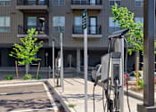 Thumbnail 16 of 29 - A charging station for electric vehicles is located outside a building.