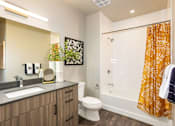 Thumbnail 7 of 29 - Bathroom with vanity and a shower with a bathtub