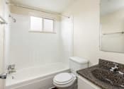 Thumbnail 17 of 31 - a bathroom with a sink toilet and bath tub