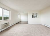 Thumbnail 26 of 31 - the living room of an empty house with a large window