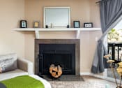 Thumbnail 3 of 35 - 3D floor plan image of a living room with a fireplace in an Aurora Colorado apartment