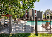 Thumbnail 29 of 35 - our apartments have a large pool and a patio with chairs