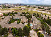 Thumbnail 48 of 50 - an aerial view of a neighborhood with houses and a city in the background