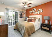 Thumbnail 9 of 50 - a bedroom with a bed and a ceiling fan