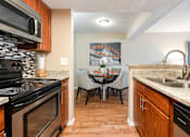 Thumbnail 4 of 50 - the kitchen and dining area of a home with a table and chairs