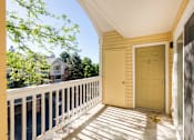 Thumbnail 27 of 50 - the front porch of a yellow house with a yellow door