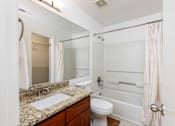 Thumbnail 26 of 50 - a bathroom with a sink toilet and shower