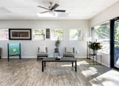 Thumbnail 33 of 39 - the preserve at ballantyne commons community room with seating and a ceiling fan