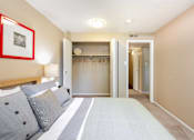 Thumbnail 11 of 39 - a living room with a couch and a closet