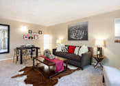 Thumbnail 2 of 39 - a living room with a couch and a table