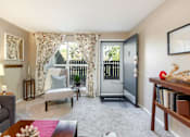 Thumbnail 4 of 39 - an open living room with a door to a balcony