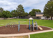 Thumbnail 32 of 34 - a playground in the middle of a park