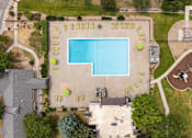 Thumbnail 12 of 34 - a birds eye view of a swimming pool in the middle of a yard with a