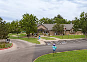 Thumbnail 26 of 34 - a view of the front of a house with a street and parking lot