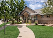 Thumbnail 27 of 34 - the front of a house with a sidewalk and lawn