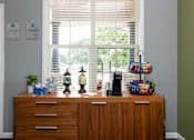 Thumbnail 29 of 34 - a wooden dresser in front of a window