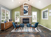 Thumbnail 30 of 34 - the living room has a large stone fireplace and blue chairs