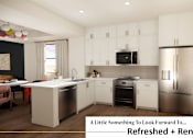 Thumbnail 2 of 34 - A kitchen with white cabinets and a black countertop.