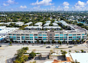 Thumbnail 29 of 31 - an aerial view of a building with a city in the background