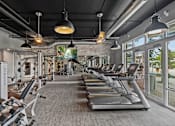 Thumbnail 22 of 31 - the gym is equipped with treadmills and other cardio equipment