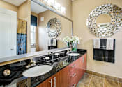Thumbnail 7 of 31 - a bathroom with two sinks and a large mirror