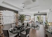 Thumbnail 2 of 31 - a dining room and living room with a table and chairs
