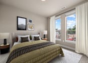 Thumbnail 39 of 39 - A bedroom with a large bed and a window overlooking a red car.