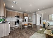 Thumbnail 2 of 39 - A modern kitchen with wooden cabinets and a dining table.