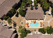 Thumbnail 24 of 43 - a house with a pool in the middle of its roof