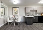 Thumbnail 5 of 43 - a dining room with a table and chairs next to a kitchen