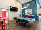 Thumbnail 67 of 87 - a game room with a pool table and a tv