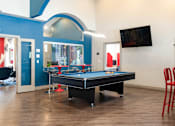 Thumbnail 68 of 87 - a game room with a pool table and a tv