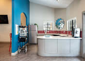 Thumbnail 71 of 87 - a kitchen with a counter top and a refrigerator and a sink