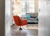 Thumbnail 19 of 87 - a living room with a couch and a chair