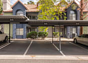 Thumbnail 75 of 87 - a parking lot with cars parked in front of a building